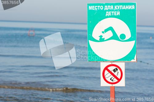 Image of Anapa, Russia - September 20, 2015: Signs a -place for bathing children and non-smoking - on sea background