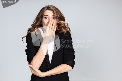 Image of Portrait of young woman with shocked facial expression