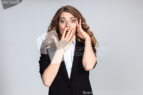 Image of Portrait of young woman with shocked facial expression