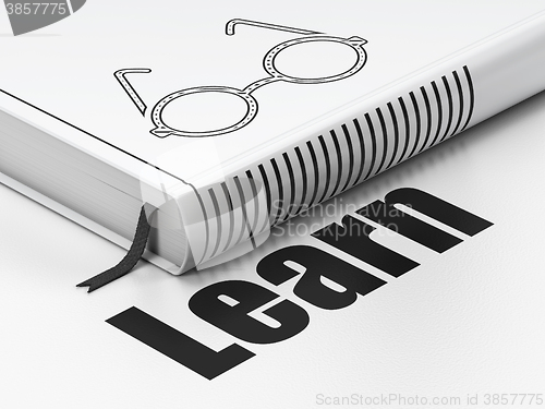 Image of Learning concept: book Glasses, Learn on white background