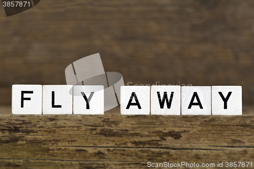 Image of The words fly away written in cubes