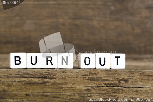 Image of The words burn out written in cubes