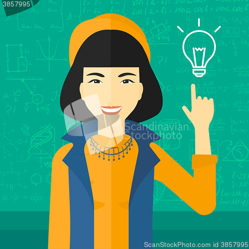 Image of Woman pointing at light bulb.