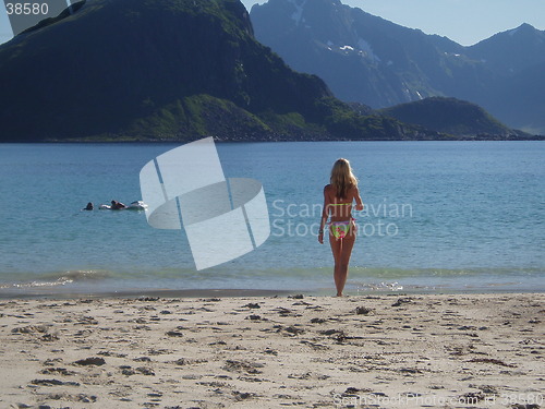 Image of Soon testing the water temperature at the beautiful beach in Lofoten.