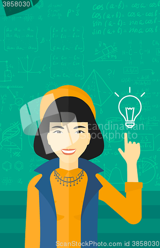 Image of Woman pointing at light bulb.