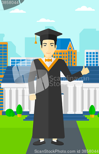 Image of Graduate showing thumb up sign.