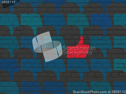 Image of Social network concept: thumb up icon on wall background