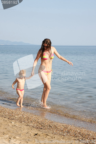 Image of Mother and daughter in same bikinis