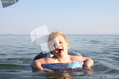 Image of Baby girl enjoying in the sea