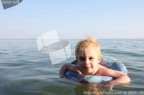 Image of Baby girl enjoying in the sea