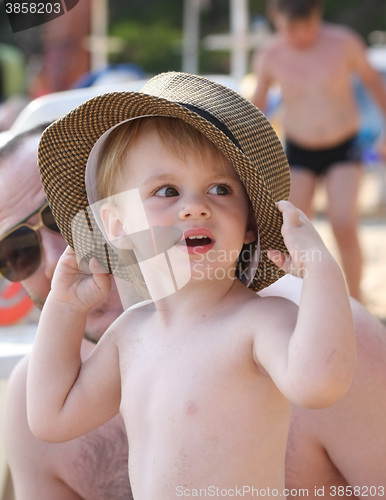 Image of Baby girl posing on the beach