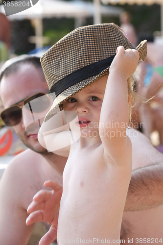 Image of Baby girl posing on the beach