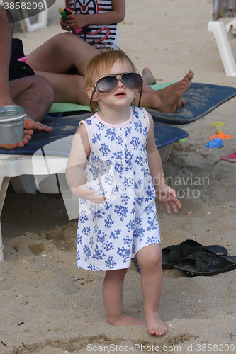 Image of Baby girl posing on the beach