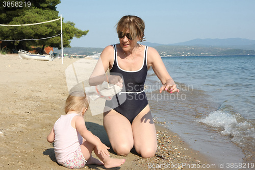 Image of Grandmother and her granddaughter on the beach