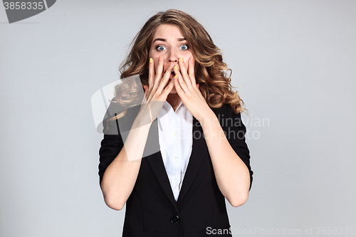 Image of Portrait of young woman with shocked facial expression