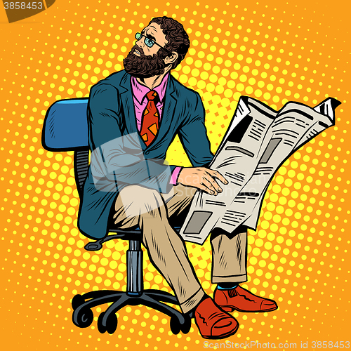 Image of Bearded businessman reading a newspaper