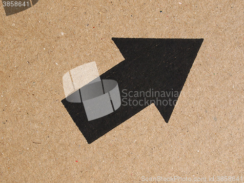 Image of Black arrow on cardboard