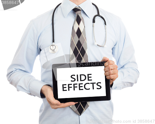 Image of Doctor holding tablet - Side effects