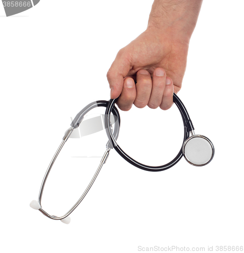 Image of Image of a medical doctor with a stethoscope in his hands isolat