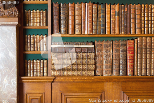 Image of Bookshelf. Vintage books collection, antique book textured cover