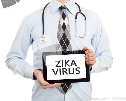 Image of Doctor holding tablet - Zika virus