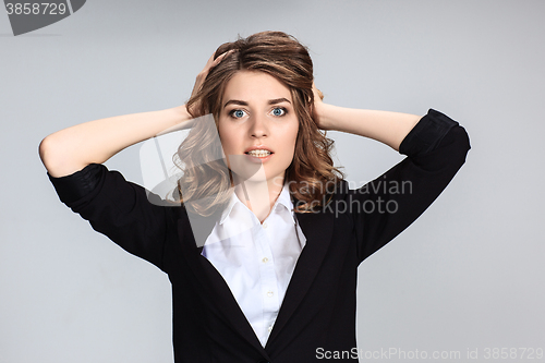 Image of Portrait of young woman with shocked facial expression