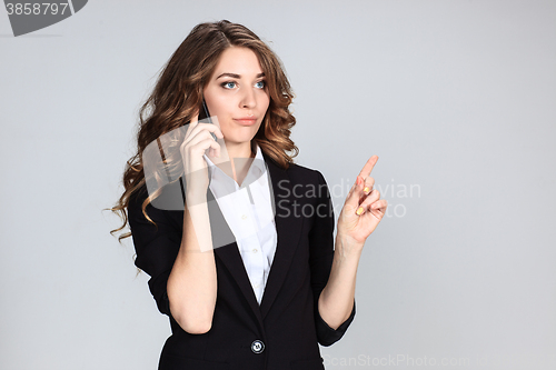 Image of Portrait of young woman with phone