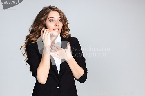 Image of Portrait of young woman with phone