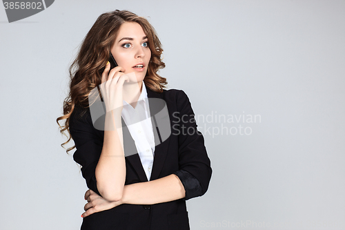 Image of Portrait of young woman with phone