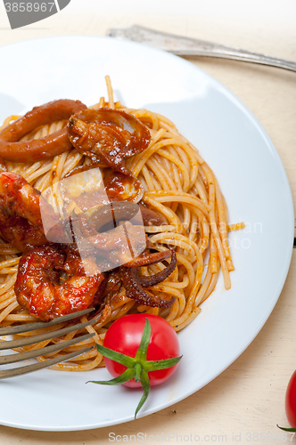 Image of Italian seafood spaghetti pasta on red tomato sauce 