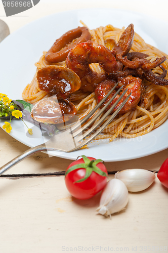 Image of Italian seafood spaghetti pasta on red tomato sauce 