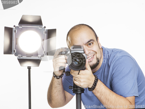 Image of professional photographer with photographic equipment