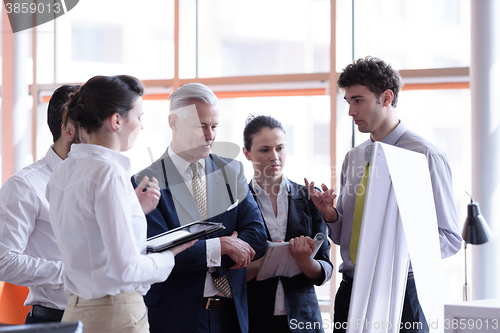 Image of young startup businessman making presentation to senior investio