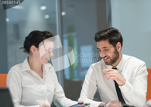 Image of young business couple working together on project