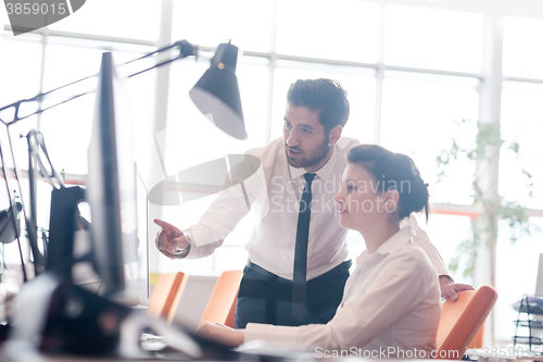 Image of business couple working together on project