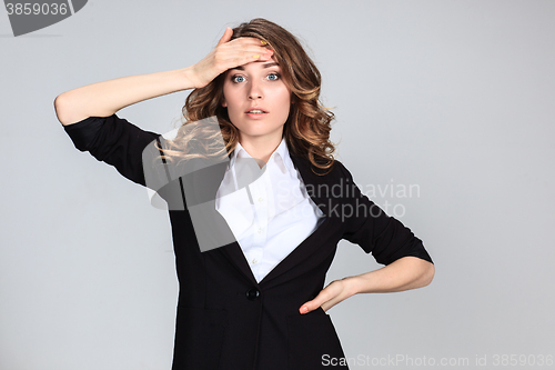 Image of Portrait of young woman with shocked facial expression