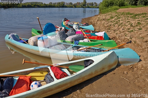 Image of Canoes on the Riverside
