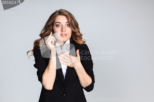 Image of Portrait of young woman with phone