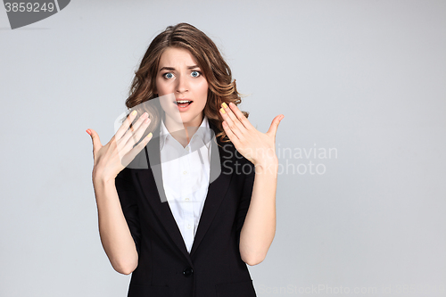 Image of Portrait of young woman with shocked facial expression