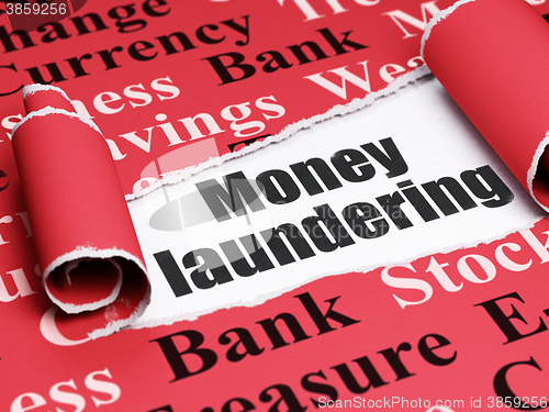 Image of Money concept: black text Money Laundering under the piece of  torn paper
