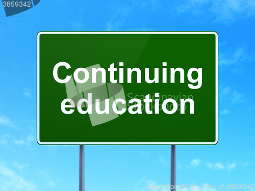 Image of Studying concept: Continuing Education on road sign background