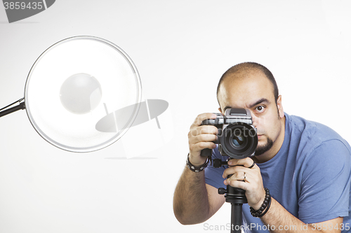 Image of professional photographer with photographic equipment