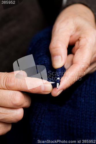 Image of Senior woman knitting