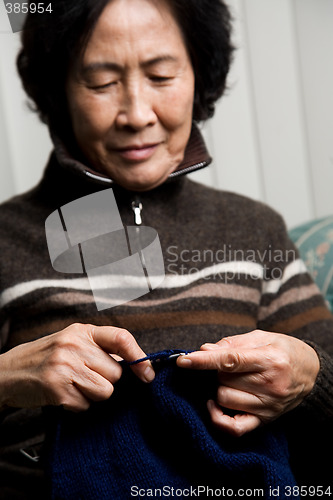 Image of Senior woman knitting