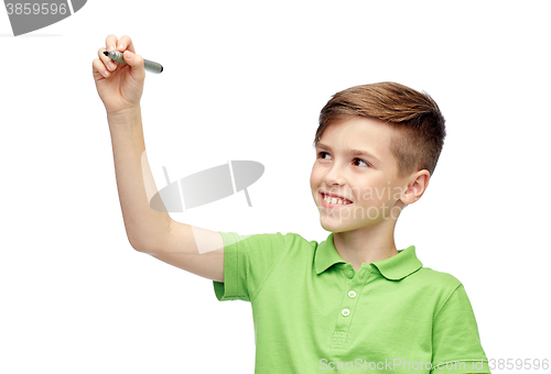 Image of happy boy in green t-shirt with marker writing