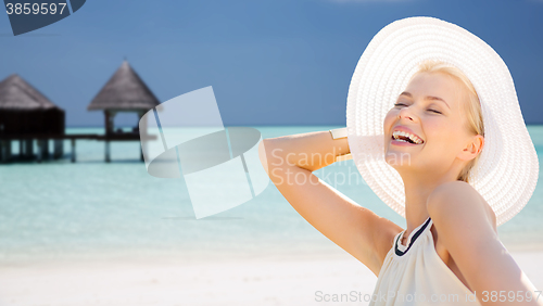 Image of beautiful woman enjoying summer over exotic beach