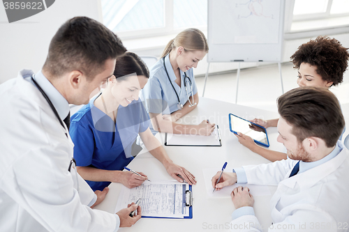 Image of group of happy doctors meeting at hospital office