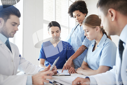 Image of group of doctors meeting at hospital office