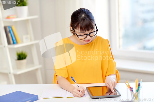 Image of asian woman student with tablet pc at home