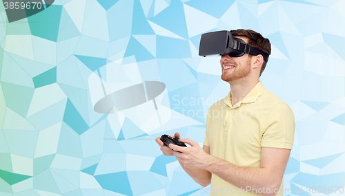Image of happy man in virtual reality headset with gamepad